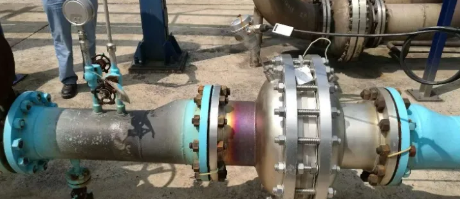 Under what circumstances should the flame arrester in a VOCs waste gas incineration system be replaced?